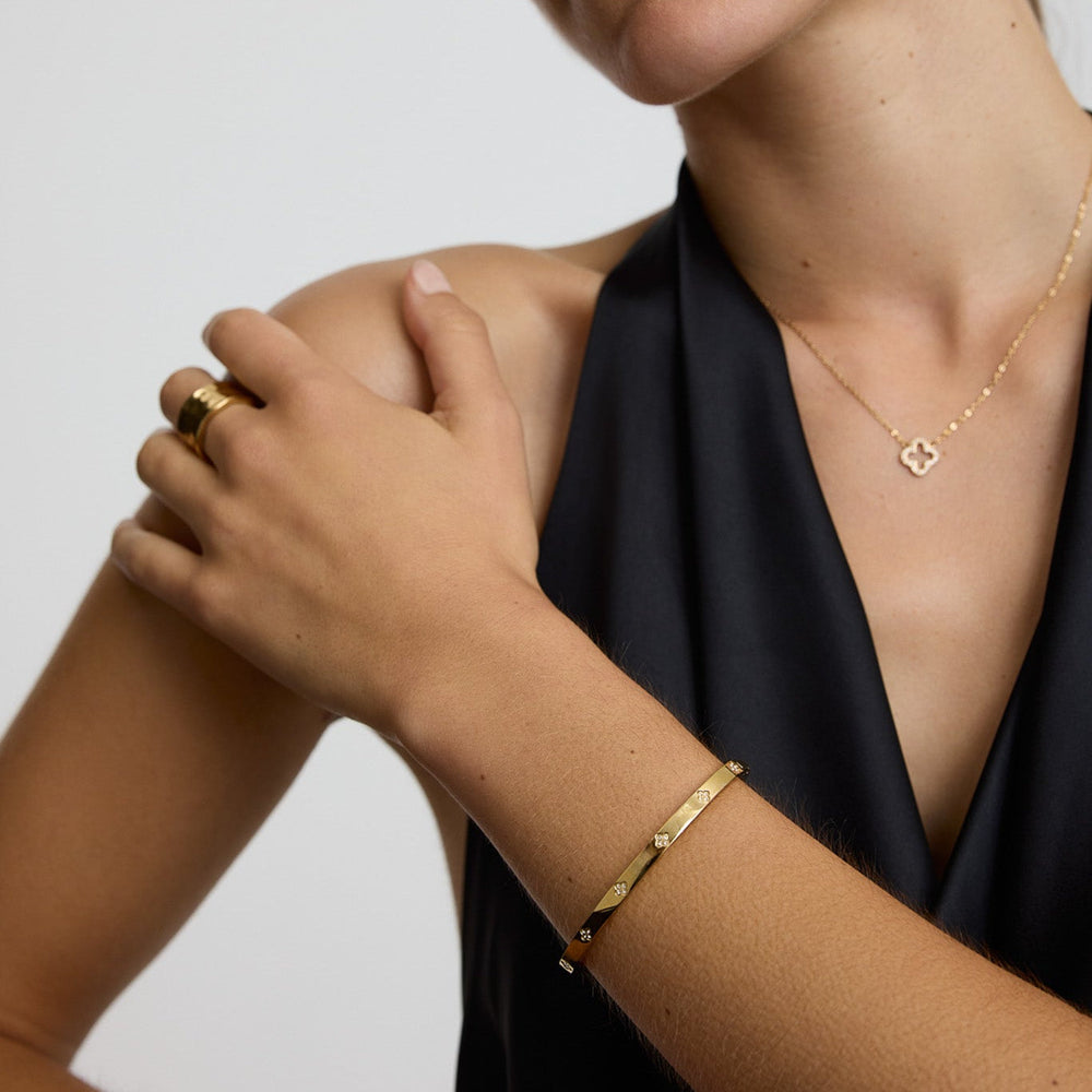 https://cdn.shopify.com/s/files/1/0481/1984/0936/files/Clover_Bangle_2030.jpg?v=1763034516