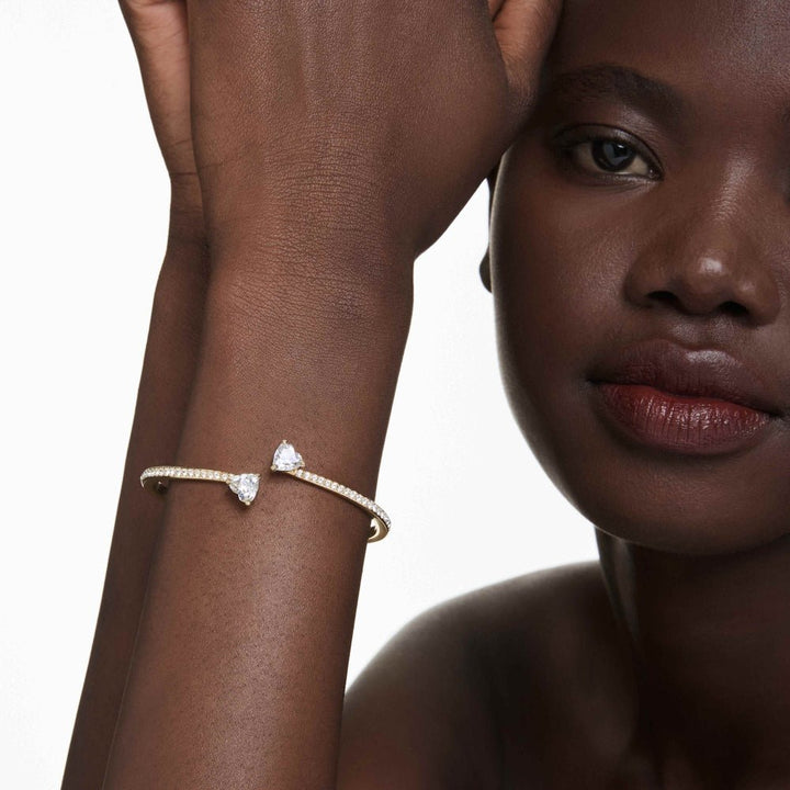 Swarovski Mesmera Gold - Tone Plated White Heart Attract Medium Bangle - MococoSwarovski57334749009657334743Bracelets